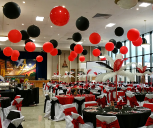 Red and Black three foot balloons hung from ceiling